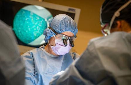 Orthopaedic surgeon Lance G. Warhold, MD, during a carpal tunnel release surgery.   